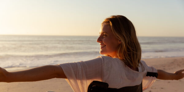 A women in a wheelchair at the beach