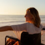 A women in a wheelchair at the beach